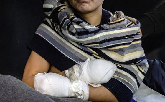 Ukrainian President Volodymyr Zelensky posted this image of an injured North Korean soldier with bandages around his hands.