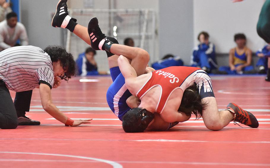 Aviano's Jevan Smith gets set to pin Rota's Ethan Anderson in a 150-pound match Saturday, Feb. 4, 2023, at the DODEA-Europe Southern Europe regional at Aviano Air Base, Italy.