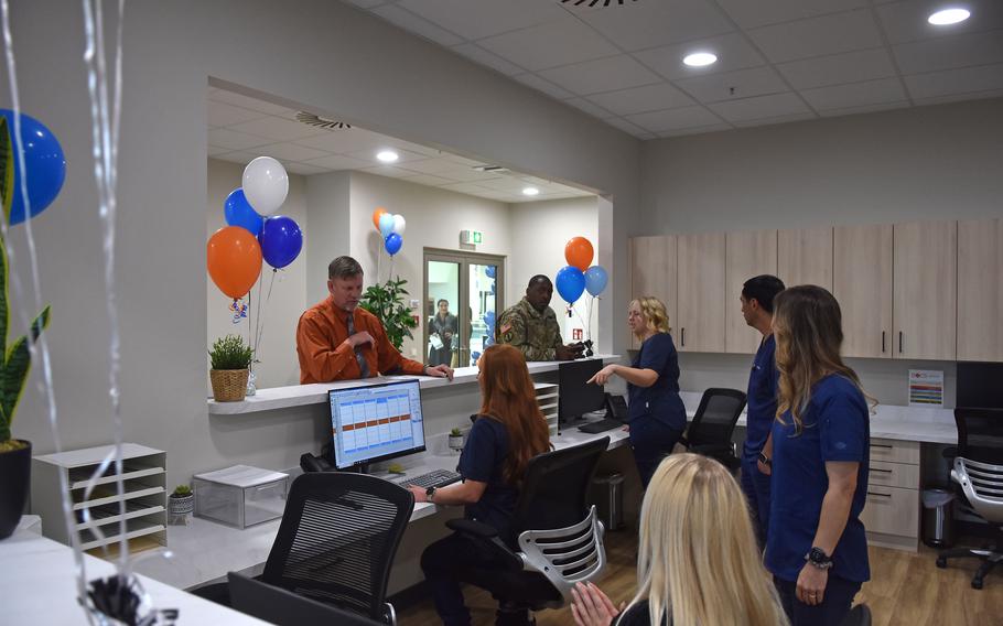 Staffers at the Docs Dental clinic at the exchange at Ramstein Air Base in Germany celebrate its grand opening Oct. 2, 2023. It  is the first of the company's clinics at a U.S. base overseas.