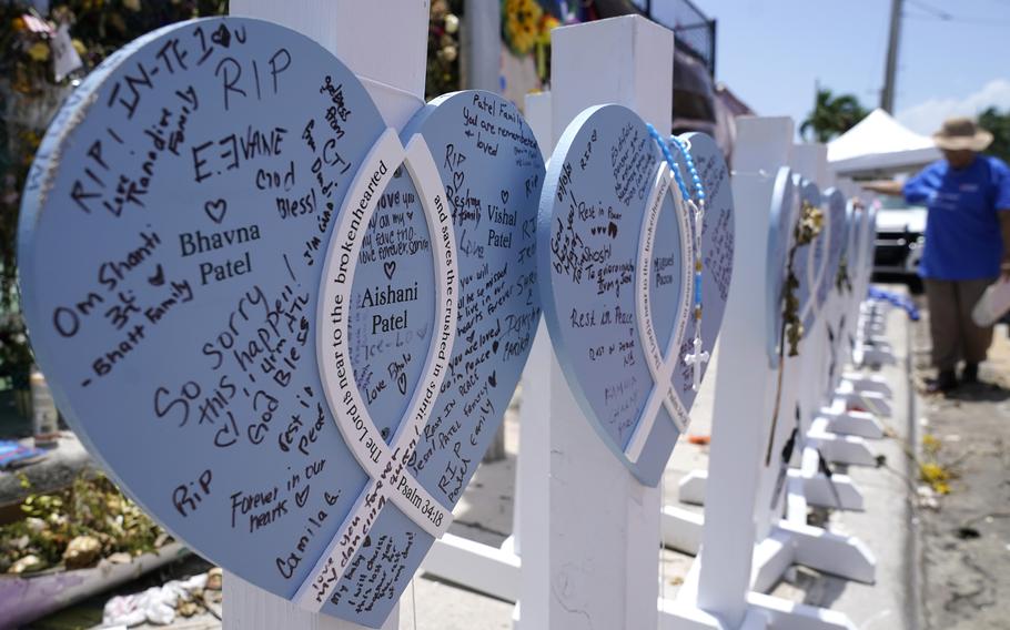 A wooden heart at a makeshift memorial remembers the family of Vishal and Bhavna Patel, who died along with their 1-year-old daughter Aishani, in the collapse of the Champlain Towers South building.