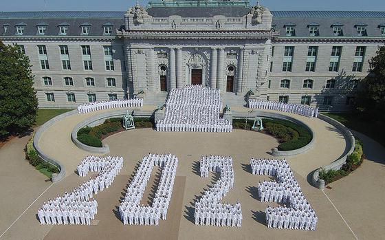 An aerial view shows cadets standing in a configuration at the U.S. Naval Academy in Annapolis, Md., to from “2023” on April 26, 2023, one month out from their graduation day. 