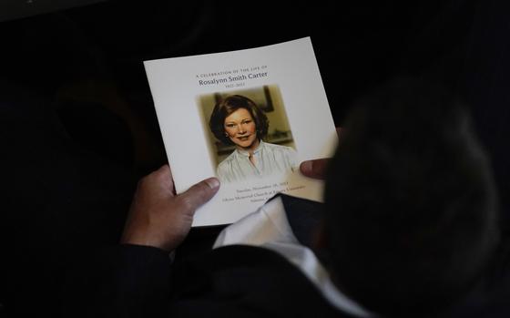 Attendees are seated before a tribute service for former first lady Rosalynn Carter at Glenn Memorial Church in Atlanta.