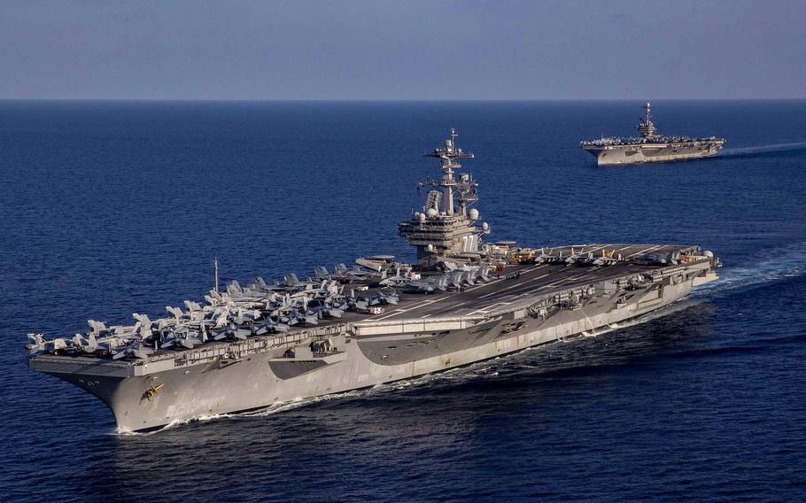 The aircraft carrier USS George H.W. Bush, front, and USS Harry S. Truman sail in the Ionian Sea, Aug. 27, 2022. The Truman has since passed through the Strait of Gibraltar, into the Atlantic Ocean.