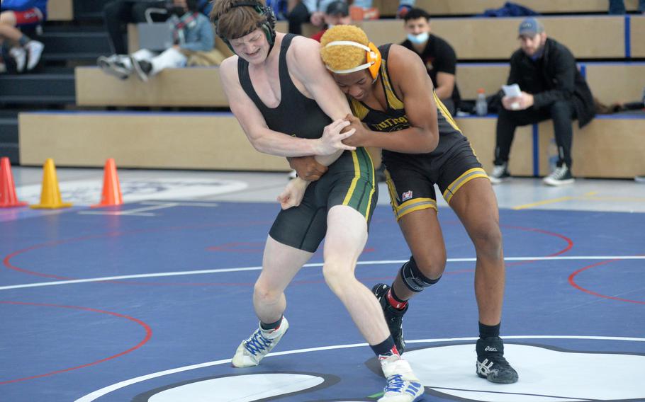 Alconbury’s Ezekiel Seigrist struggles against Stuttgart’s Valentino Antoine in a 144-pound match on the second day of action at the high school 2022 Wrestling Tournament in Ramstein, Germany, Feb. 11, 2022.