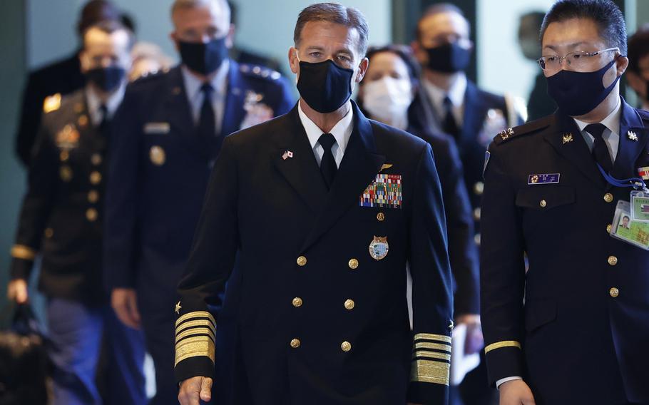 Adm. John Aquilino, center, Commander of the United States Indo-Pacific Command, arrives for a meeting with Japan’s Prime Minister Fumio Kishida, not shown, at his official residence in Tokyo, Japan, Thursday, Nov. 11, 2021.