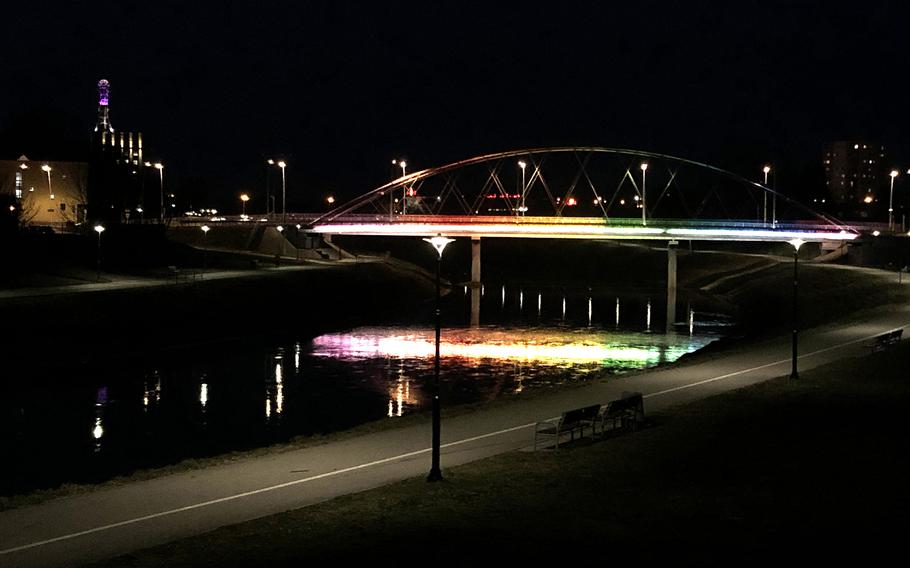 The colorful Narutowicza Bridge is reflected in the Wislok River that flows through Rzeszow, Poland.