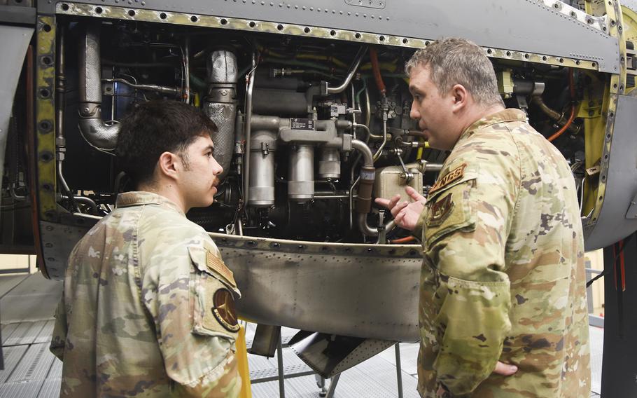 Senior Airman Pablo Ruiz Esparza Barco, left, and Tech. Sgt. Ty Ward conduct an insochronal inspection on a C-130J Super Hercules engine at Yokota Air Base, Japan, on June 21, 2024.