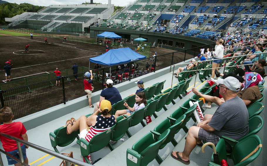 People watch the U.S. Women's Olympic softball team's exhibition game against the Toyota Red Terriers in Iwakuni, Japan, Monday, July 12, 2021.