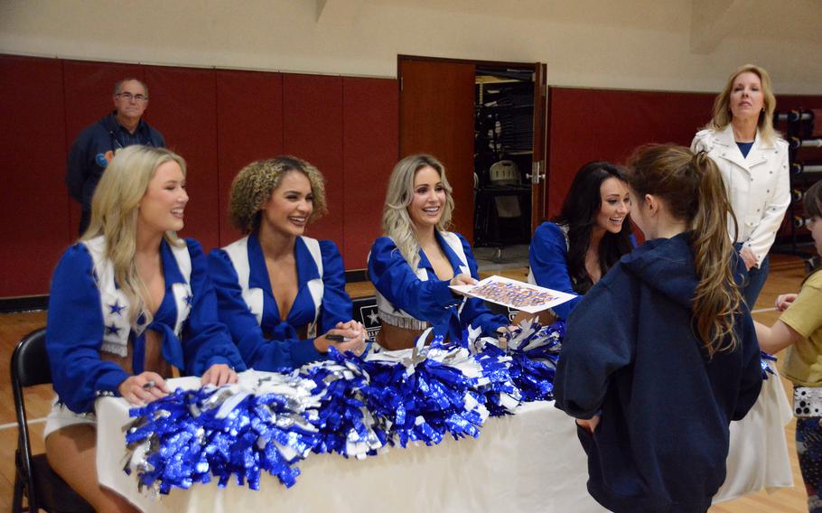 Dallas Cowboys Cheerleaders sign autographs at John W. Collier Fitness Center at Camp Humphreys, South Korea, Feb. 23, 2024.