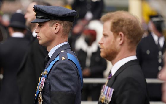 Prince William, center, and Prince Harry, right, walk behind the coffin of Queen Elizabeth II being pulled past Buckingham Palace following her funeral service at Westminster Abbey in central London, on Sept. 19, 2022. An explosive memoir reveals many facets of Prince Harry, from bereaved boy and troubled teen to wartime soldier and unhappy royal. From accounts of cocaine use and losing his virginity to raw family rifts, “Spare” exposes deeply personal details about Harry and the wider royal family. It is dominated by Harry's rivalry with brother Prince William and the death of the boys’ mother, Princess Diana in 1997. 