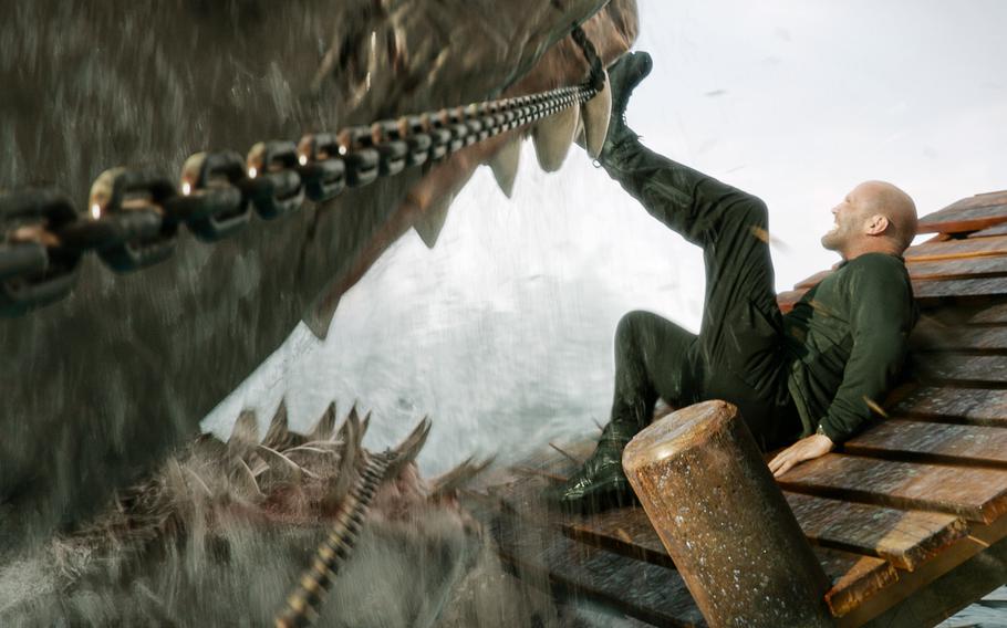 Jason Statham has his hands full -- and then some -- in a scene from “Meg 2: The Trench.” 