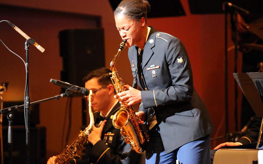 Spc. Brooke Hendricks, of the U.S. Army Japan Band, plays a saxophone solo during a holiday concert at Camp Zama, Dec. 15, 2018. 