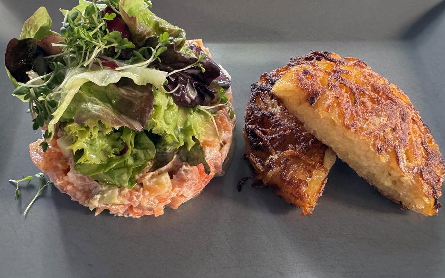 A fish tartare and a potato pancake.