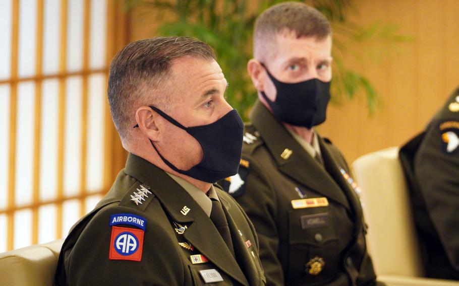 U.S. Army Pacific's commander, Gen. Charles Flynn, left, visits the Ministry of Foreign Affairs in Tokyo, Friday, Sept. 9, 2022.