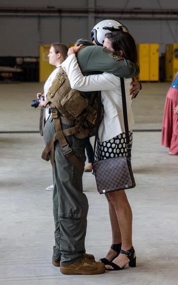 A U.S. Marine is reunited with a loved one after returning from deployment with the 26th Marine Expeditionary Unit, Marine Corps Air Station New River, N.C., Saturday, March 16, 2024.