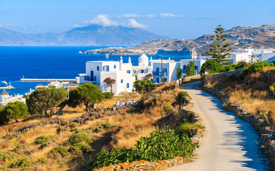 Road to Mykonos port, Mykonos island, Greece. The roads are narrow. The hills are steep and driving can be a challenge, but that's part of the adventure.