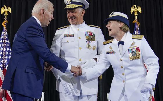 President Joe Biden shakes hands with Adm. Linda Fagan, Commandant of the U.S. Coast Guard, during a change of command ceremony at U.S. Coast Guard headquarters, Wednesday, June 1, 2022, in Washington. Adm. Karl L. Schultz, center, was relieved by Fagan, who is the armed forces' first female service chief. (AP Photo/Evan Vucci)