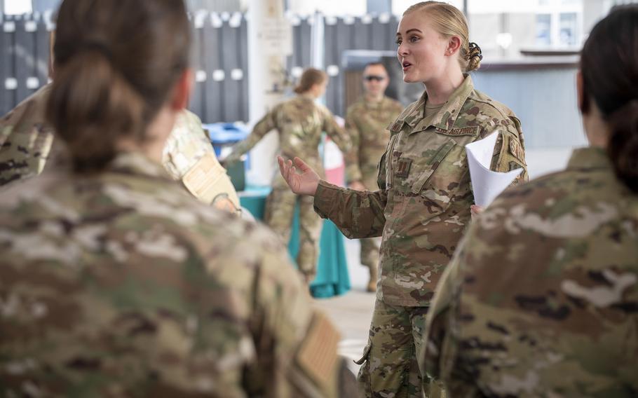 Air Force Capt. Emma Wahlig, 380th Air Expeditionary Wing sexual assault response coordinator, gives directions to the Teal Team 6 volunteers before their induction ceremony, at Al Dhafra Air Base, United Arab Emirates, June 18, 2021.