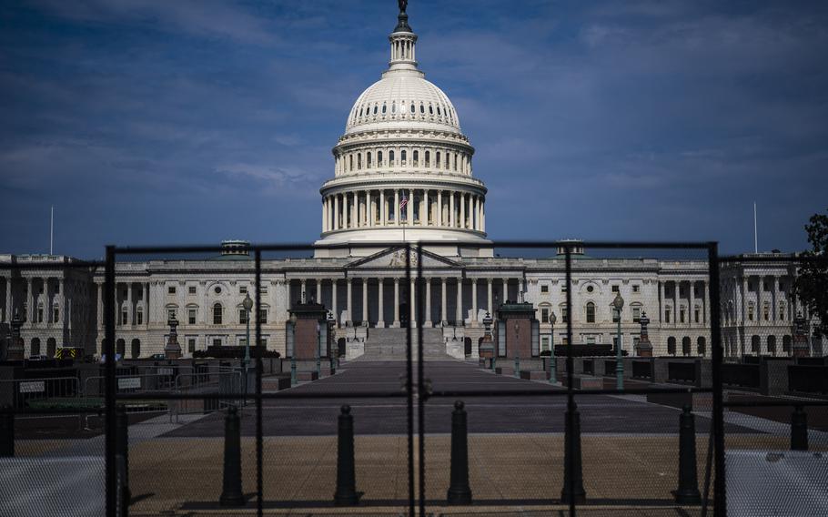 Fencing, erected after the Jan. 6 riot, is seen surrounding the Capitol building in Washington on July 09, 2021. 