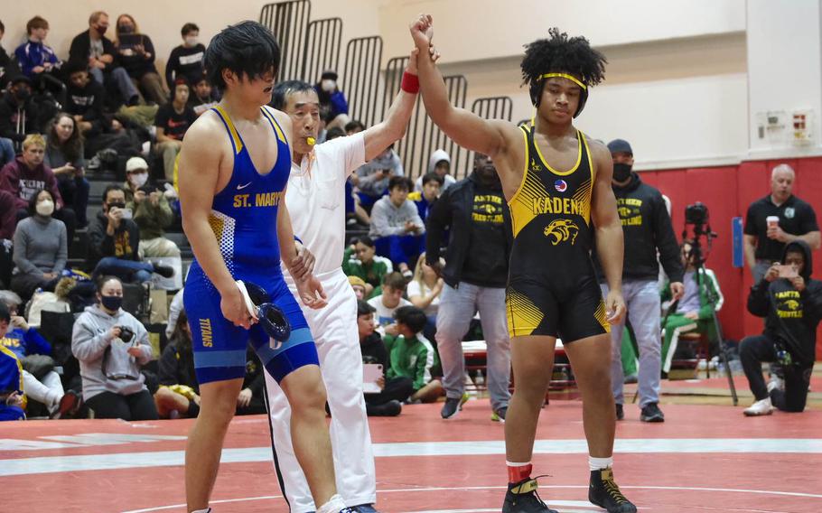 Jeremiah Drummer of Kadena is declared the winner over St. Mary’s  Matthew Araya after winning the Beast of the East 180-pound weight class.