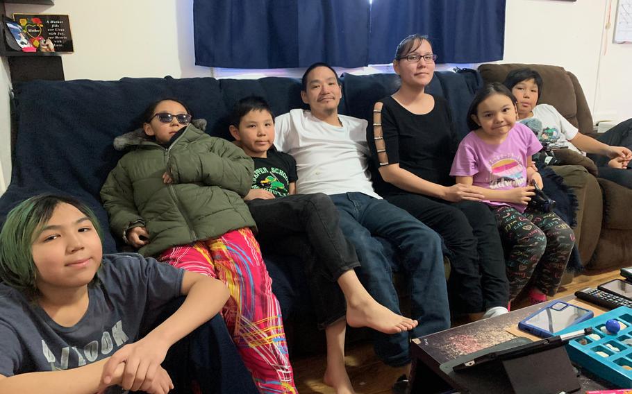 Bruce Nukapigak poses for a portrait with his family in Nuiqsut, Alaska, on April 22, 2022. 