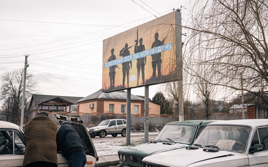 A billboard in Kupyansk, Ukraine reads “Thank you armed Armed Forces of Ukraine for a New Day.” The city, once occupied by Russian forces and later retaken by Ukrainians, has been under siege for months as Russia seeks to take it back.