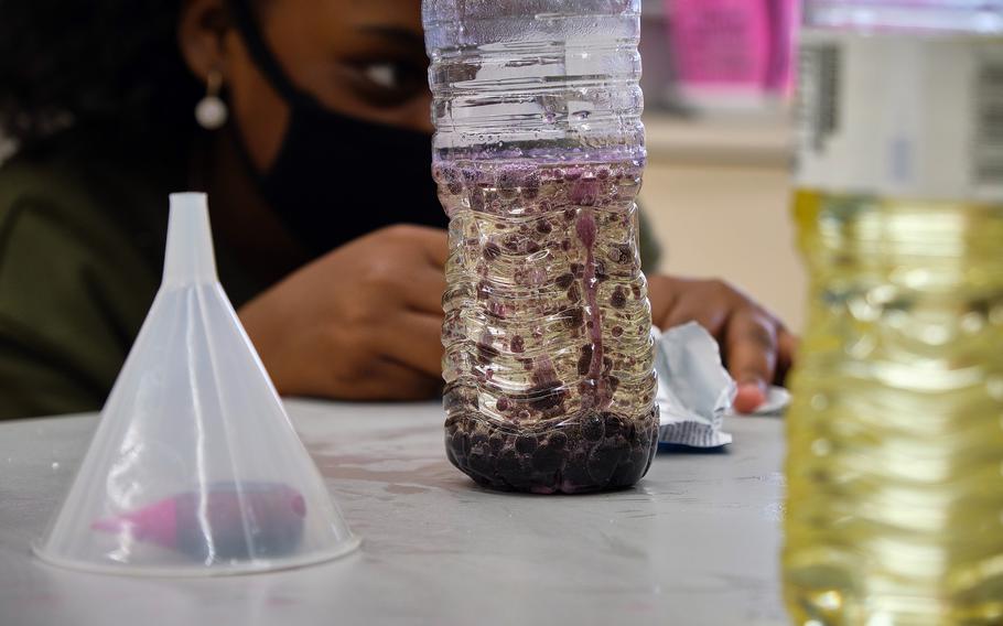 A student at Lanham Elementary School creates her own lava lamp during a STEAM event at Naval Air Facility Atsugi, Japan, May 27, 2021.