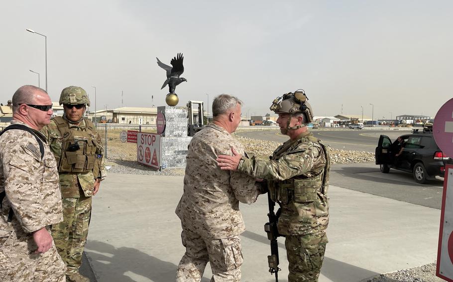 U.S. Marine Corps Gen. Frank McKenzie, the commander of U.S. Central Command, meets with U.S. Navy Rear Adm. Peter Vasely, commander of U.S. Forces Afghanistan-Forward, at Hamid Karzai International Airport, Afghanistan on Aug. 17, 2021. 