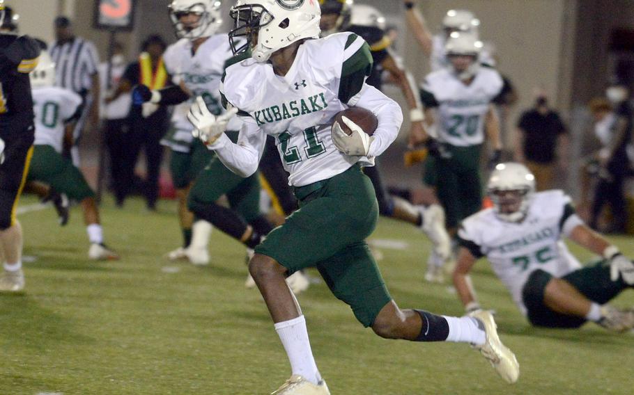 Kubasaki running back Jalen Keller scampers around left end against Kadena.