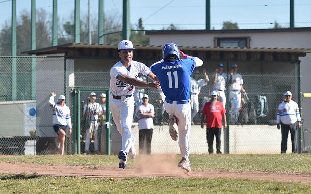 Ramstein's Christian Roy tags Wiesbaden's Jonah Harvey during the first game of a doubleheader on April 12, 2025, at Southside Fitness Center on Ramstein Air Base, Germany.