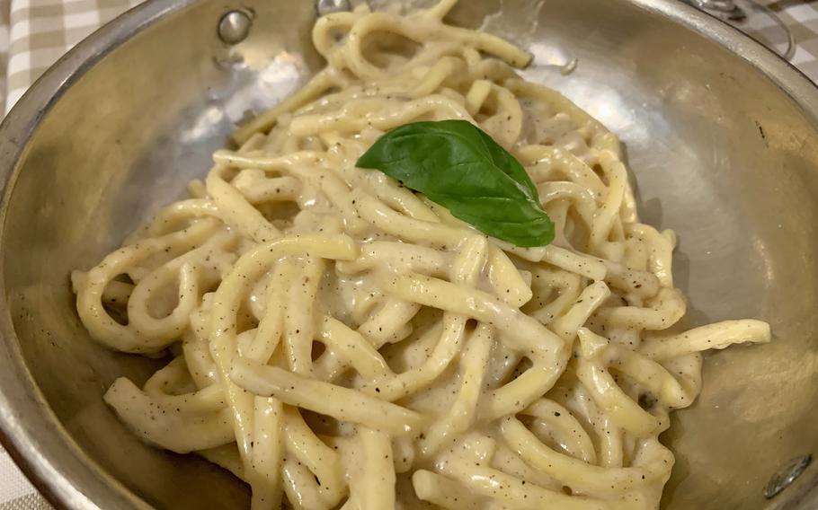 Cacio e pepe features shorter, wider pasta similar to spaghetti tossed with a creamy parmesan cheese sauce and plenty of freshly-cracked black pepper. The dish is more closely associated with Rome than Naples but is on the menu at Tufo.