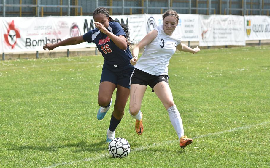 Aviano's Amirah Johnson and Vicenza's Maya Fitch battle for the ball Saturday, April 23, 2023, in the Cougars' 7-0 victory over the Saints.