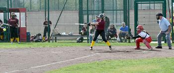 Vilseck's Morgan Robbins puts the ball in play during the first game of a doubleheader against the Kaiserslautern Raiders on Saturday at Kaiserslautern High School in Kaiserslautern, Germany.