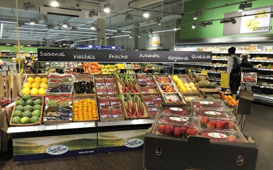 Shoppers browse in the produce section at an Edeka near Ramstein Air Base, Germany, on April 4, 2022. Russia’s war on Ukraine has driven up energy prices, leading to a spike in the cost of grocery items. A second wave of increases is happening now.