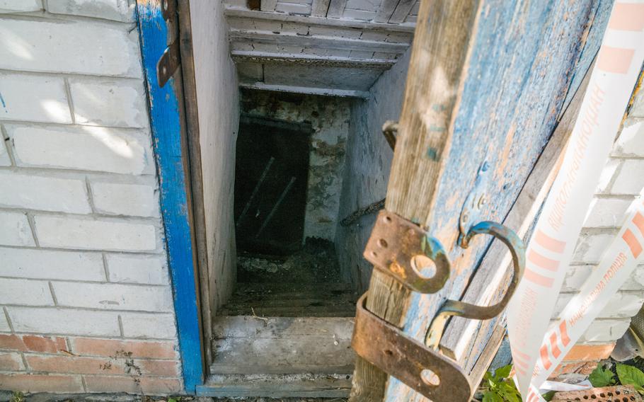The entrance to a basement allegedly used as a torture chamber in a house where prisoners were held, discovered by Ukrainian police in the center of Pisky Radkivsky, Ukraine. 