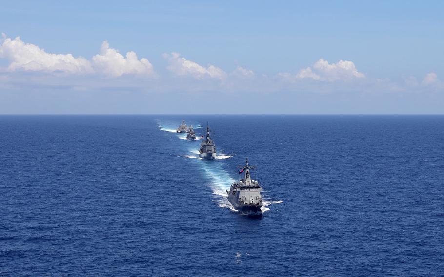 The U.S., Australia, Japan and the Philippines train in the South China Sea, within the Philippines' exclusive economic zone, Sunday, April 7, 2024.