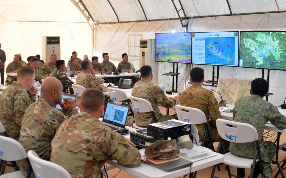 Military officers from the United States, Australia and Singapore plan drills during the Super Garuda Shield excercise at Baturaja Training Area, Indonesia, Wednesday, Aug. 10, 2022. 