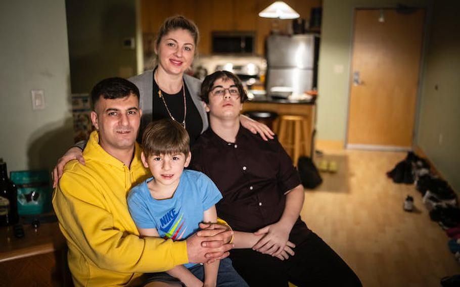 Clockwise from left; Mohammed Khuder, Olena Khuder, Ahmed Khuder, 15, and Yazan Khuder, 7, photographed at home in Minneapolis. Not pictured is their daughter Violetta, 18.