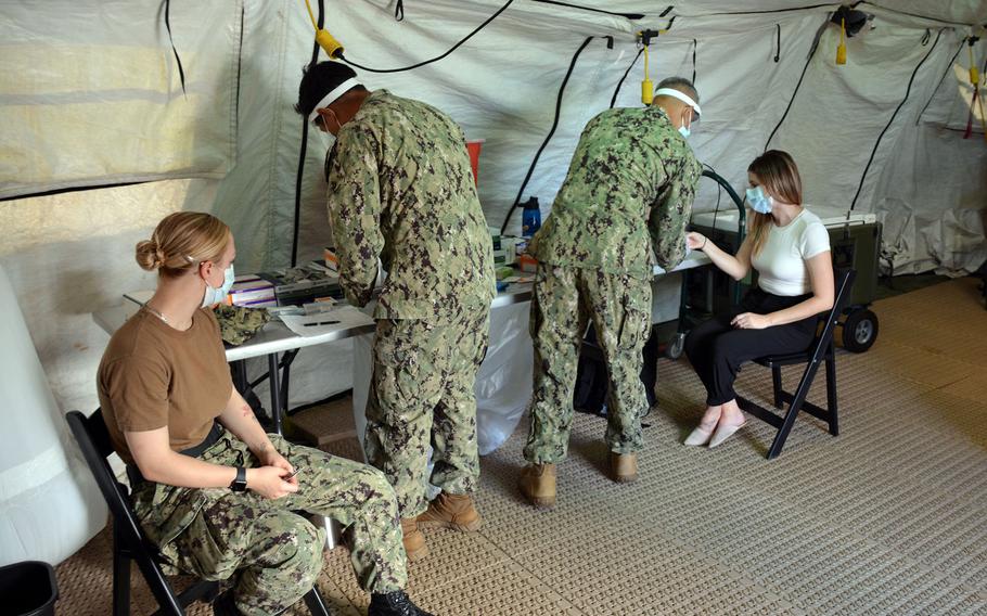 Staff members at U.S. Naval Hospital Okinawa receive the influenza vaccine at Camp Foster, Friday, Oct. 1, 2021.