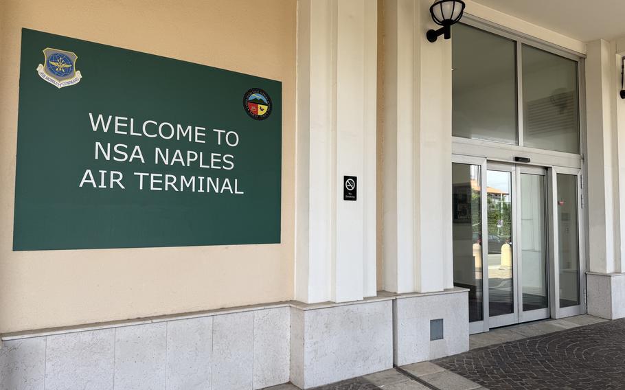 A sign says Welcome to NSA Naples Air Terminal.