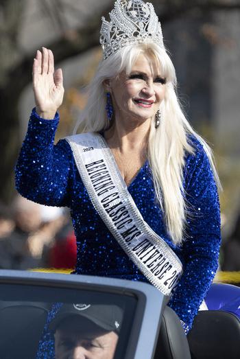 Reigning Classic Ms. Universe Glenna Rollins rides in the National Veterans Day Parade on Sunday, Nov. 12, 2023, in Washington. 