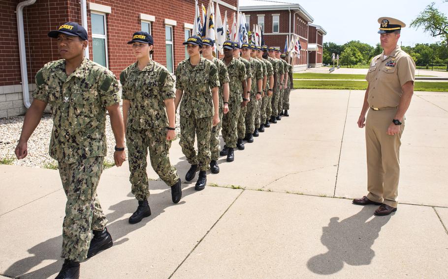 Lt. Jake Johnstone with Naval Information Warfare Center Pacific observes the recruits of Naval Training Center Great Lakes Recruit Division 247 at Naval Station Great Lakes, Ill., on July 1, 2019.