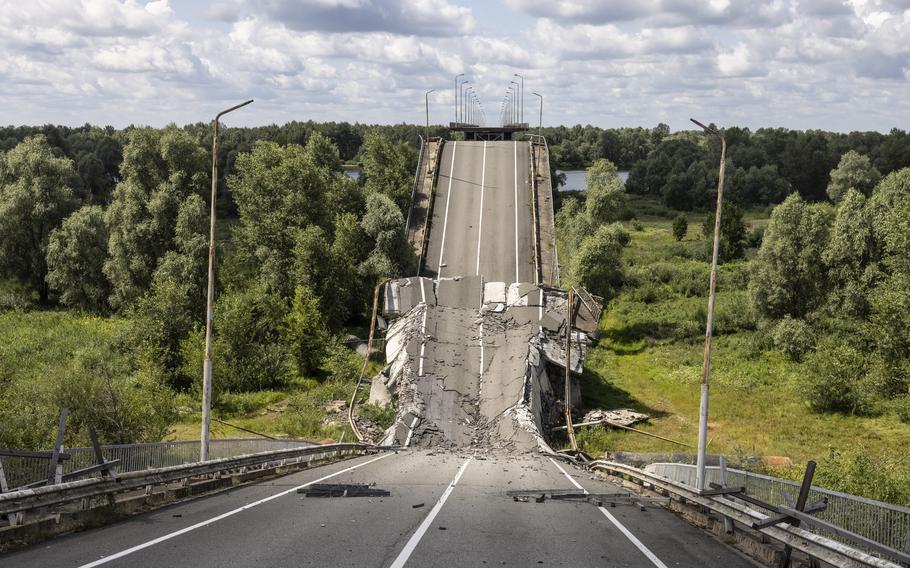 A damaged bridge that leads from Ukraine to the border with Belarus near the Slavutych border crossing on July 21, 2023. 