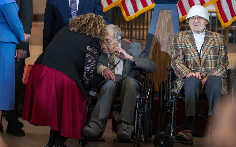 Seymour Nussenbaum listens to a well-wisher after he and fellow members of the World War II Ghost Army were awarded the Congressional Gold Medal at the U.S. Capitol in Washington, D.C., on March 21, 2024.