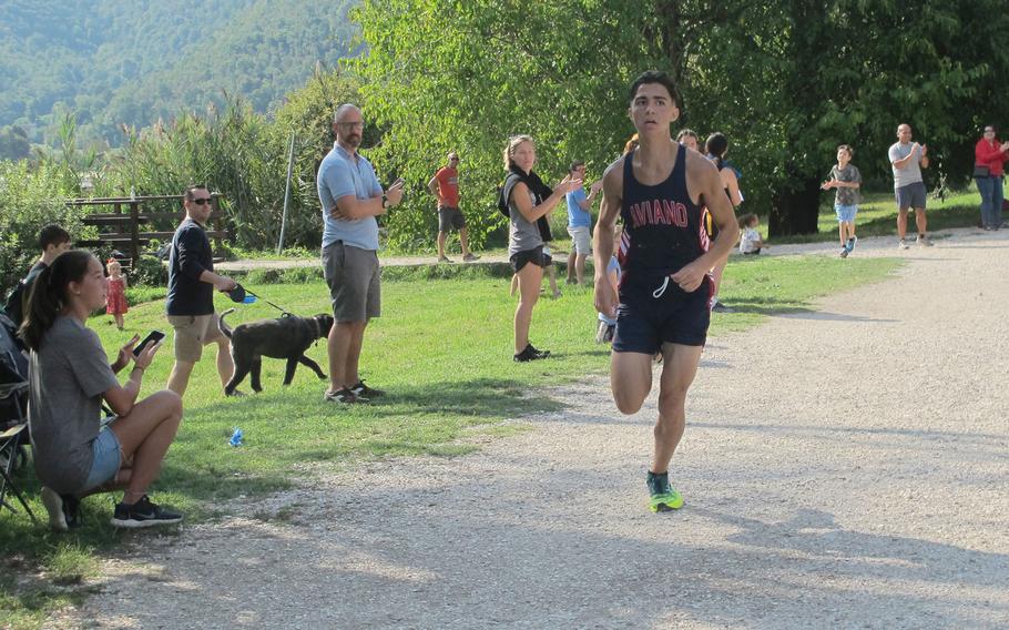 Ben Udall, a junior at Aviano, races toward the finish line at the first cross country event of the season in Italy. Udall smoked everyone else with a time of 18 minutes, 9 seconds.