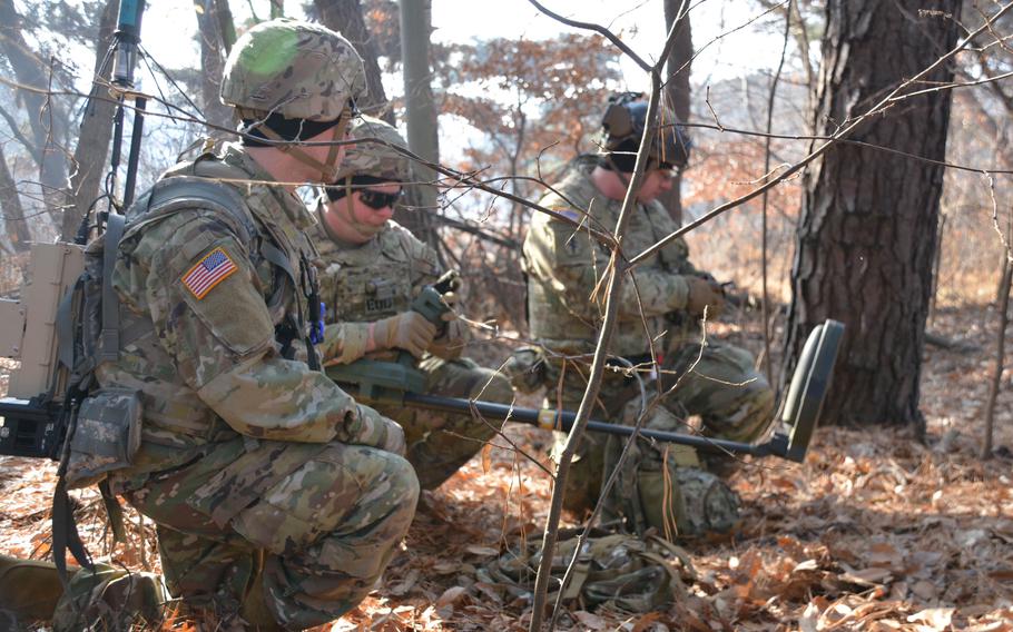 A team of explosive ordnance disposal specialists work to identify improvised explosive devices during the Korea EOD Team of the Year competition at Camp Humphreys, South Korea, Jan. 11, 2023. They are assigned to the 718th Ordnance Company (EOD), 23rd Chemical, Biological, Radiological and Nuclear Battalion.