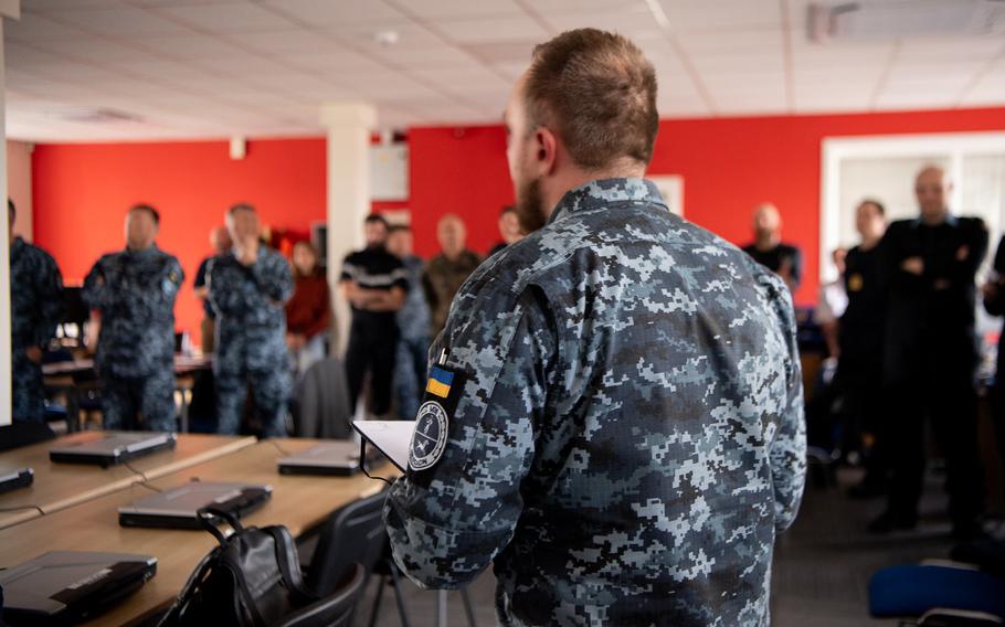 A Ukrainian sailor speaks during final planning in Glasgow, Scotland, as Sea Breeze 2024 kicks off, in a photo posted June 24, 2024. The U.S., U.K. and allies are on hand as Ukrainian ships train to detect and counter sea mines. The exercise took part in the Black Sea prior to Russia's full-scale invasion of Ukraine in 2022.