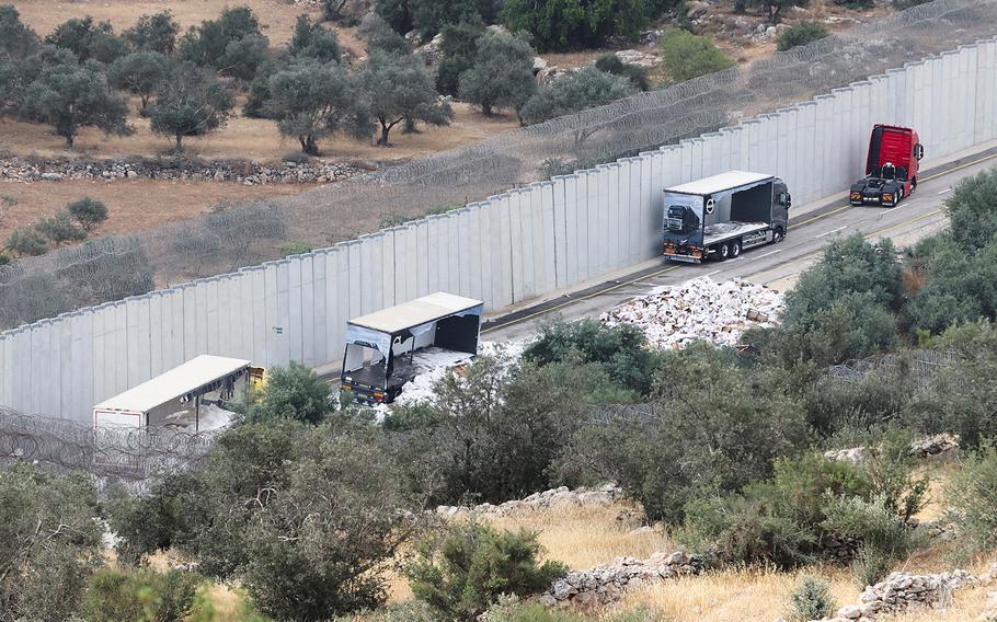 A view of trucks carrying aid to Gaza that were stopped after they were damaged by Israeli settlers near a checkpoint near Hebron in the Israeli-occupied West Bank May 14,2024. 