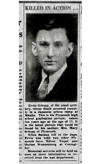 A vertical image of an old newspaper column with a black and white portrait of a man below the words “killed in action.”