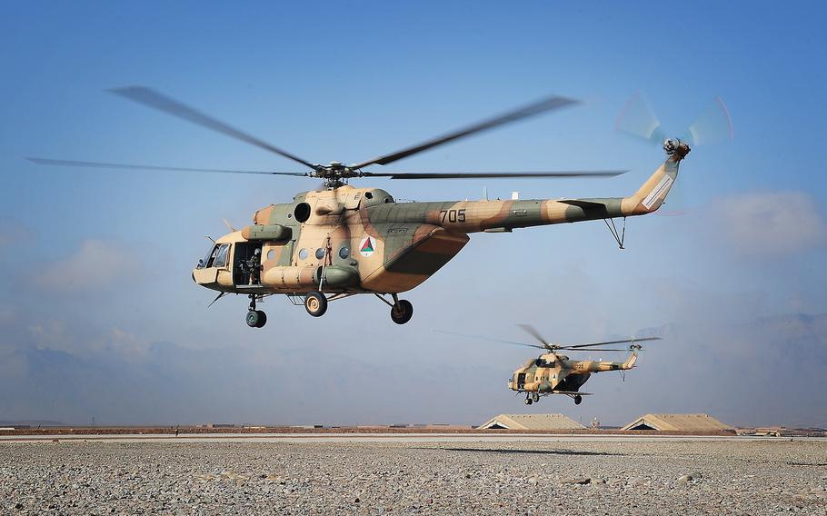 Mi-17 helicopters operated by the 2nd Wing of the Afghan National Army Air Force take off at Multinational Base Tarin Kowt in Uruzgan province, Afghanistan, Feb. 23, 2013.